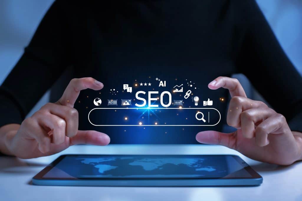 Hands holding a digital display showcasing SEO and AI icons, representing Delaware Digital Media's services